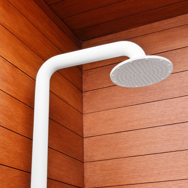 Shower head placed in front of Acre By Modern Mill siding