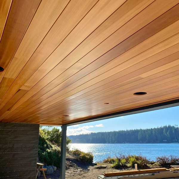 Clear vertical grain western red cedar on a ceiling with the beach in the background. 