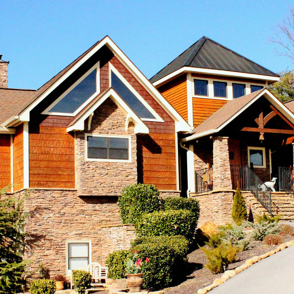 Adze siding offers great color on this home and a unique pattern.