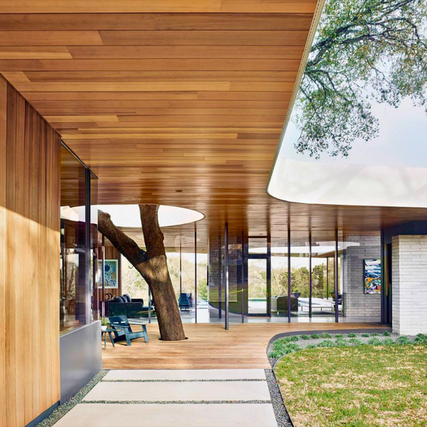 indoor outdoor covered living space with wood paneling on ceiling
