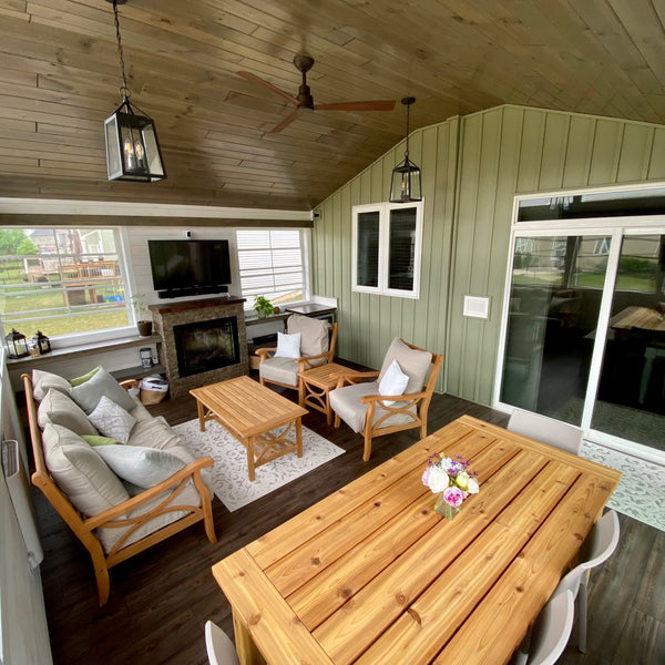 Sun room with drift wood paneling on the ceiling. 