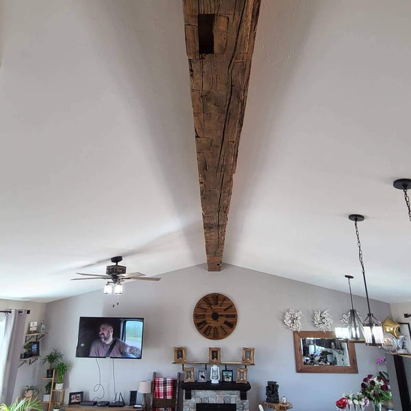 A Hand Hewn Hollow Beam Wrap stretches' the length of the room