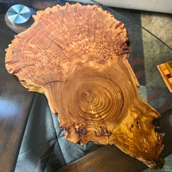 Serving board made out of burl hardwood cookie. 