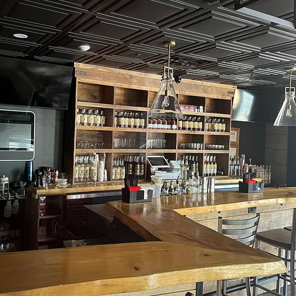 Bar area with hardwood slabs being used as the bar top. 