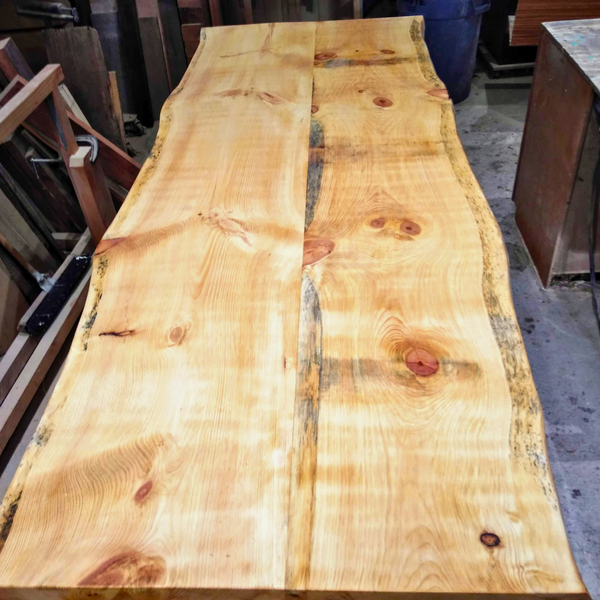 Hardwood slab being prepared as a table in the workshop. 
