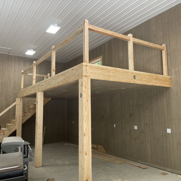 A railing with stairs made out of old wood surfacing 