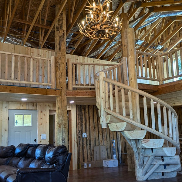 Log spiral staircase going up to loft
