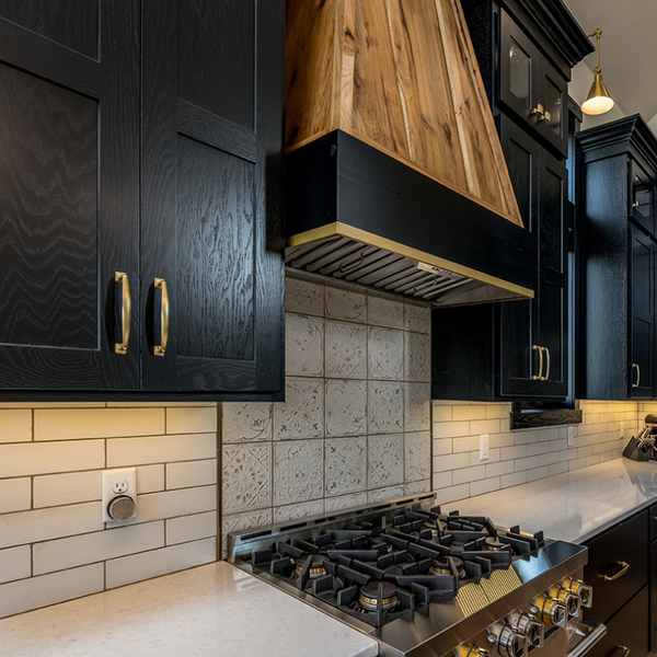 Black Kitchen Cabinets with Wood Range Hood from Showplace Cabinetry