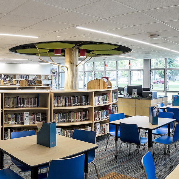 Two Solid Character Posts with Flare Bottoms are on display as trees in the Steger Library