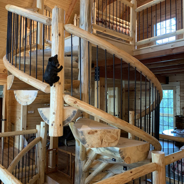 A spiral staircase is suitable for this open environment.