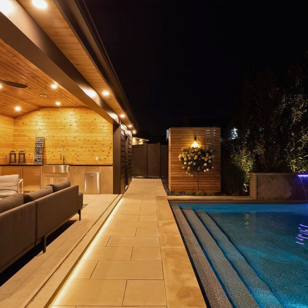 outdoor living area with cedar paneling walls and ceiling