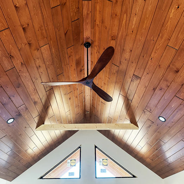 A ceiling finished with White Pine T&G Paneling Pre-finished - Copper.