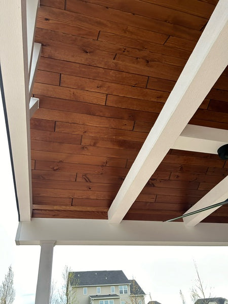 A ceiling finished with white beams and White Pine T&G Paneling Pre-finished - Copper