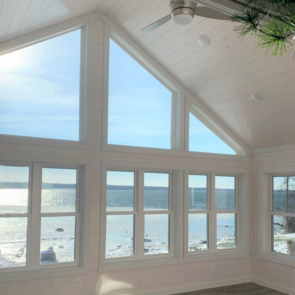 Whitewash covers the walls and ceiling with a perfect lakefront view.