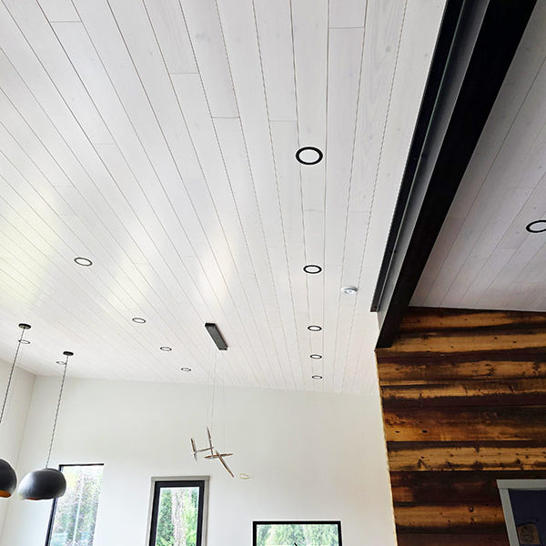 White Pine T&G Paneling Pre-finished - Whitewash - Homestead Timbers on the ceiling of a house.