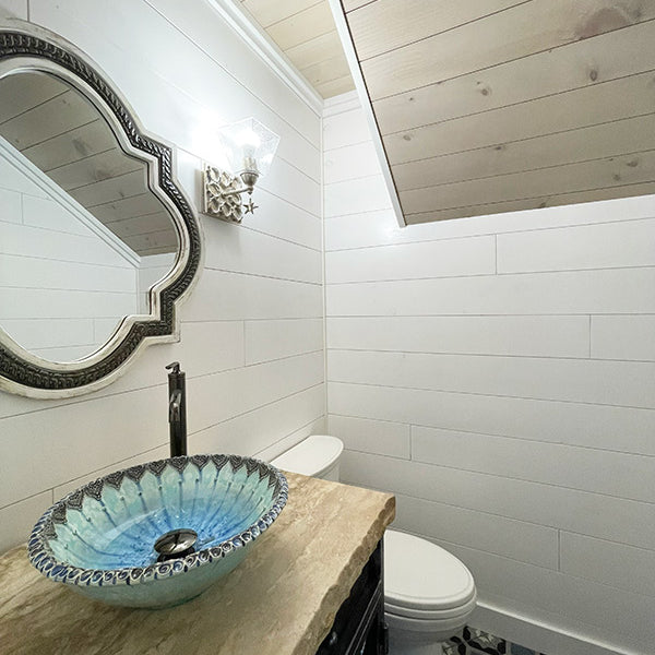 Newly finished half bathroom with white pine tongue and groove pre finish. Completed with a bowl style sink.