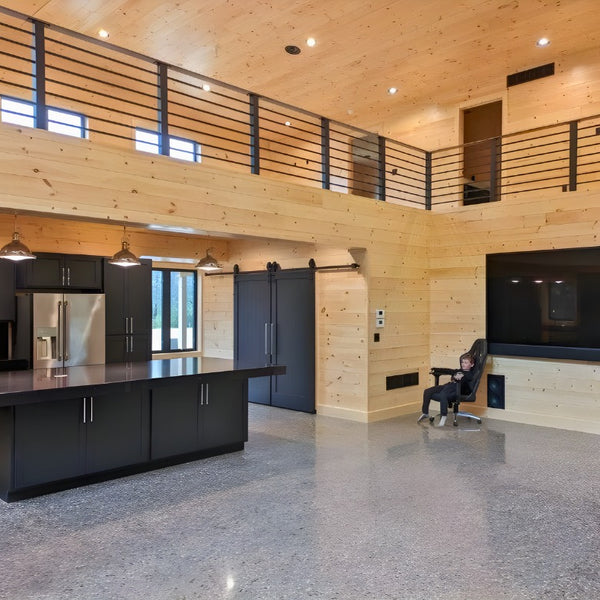 A kitchen with a open upstairs and white tongue and groove. 