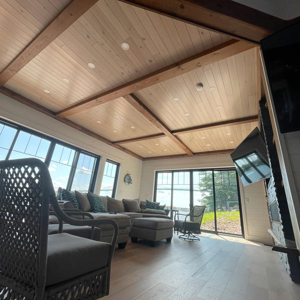 Farmhouse glaze and arctic white on display with wooden beams crossing the ceiling