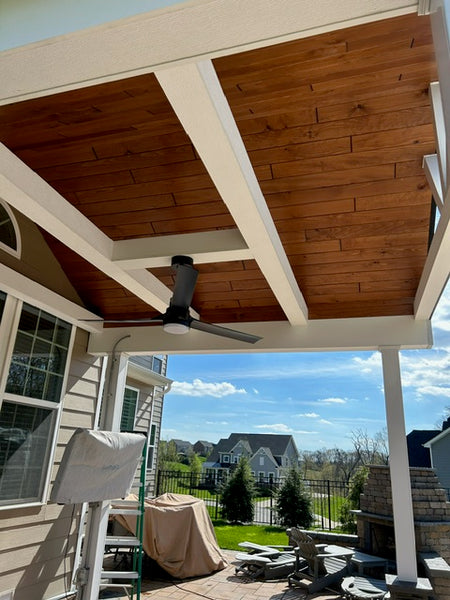White beams used on the ceiling to bring out the contrast of the dark cedar paneling. 