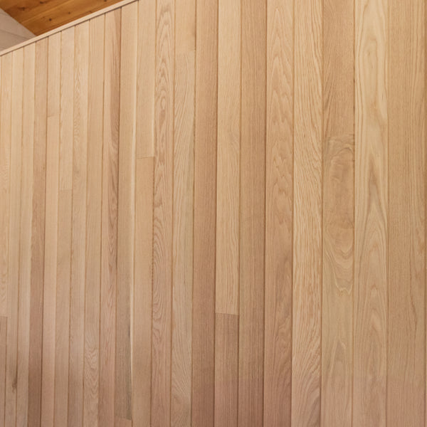 A oak wall displayed behind the desk.