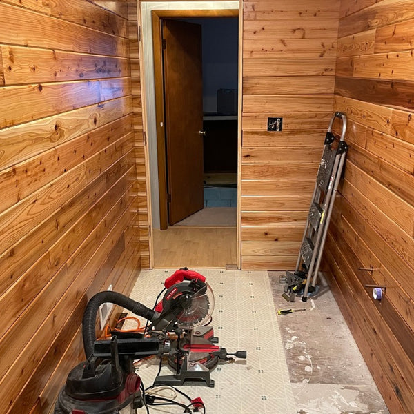 bathroom remodel with new cedar paneling installed on walls