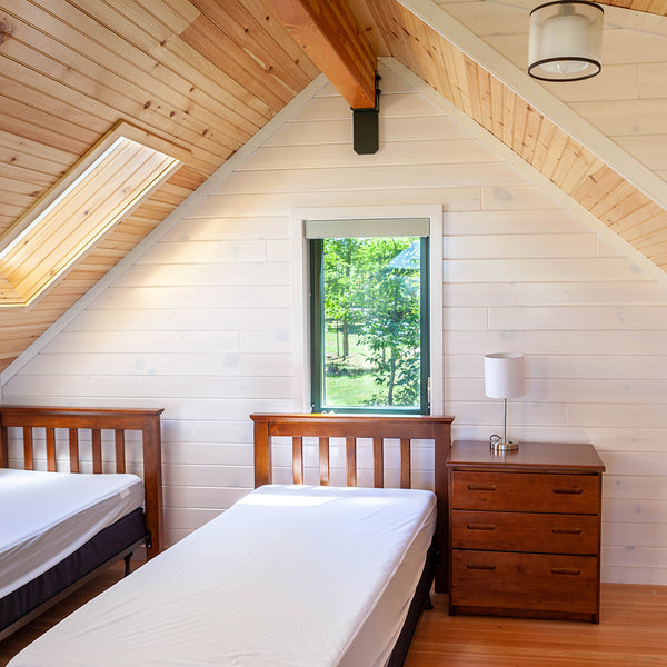 Whitewash paneling in an attic.