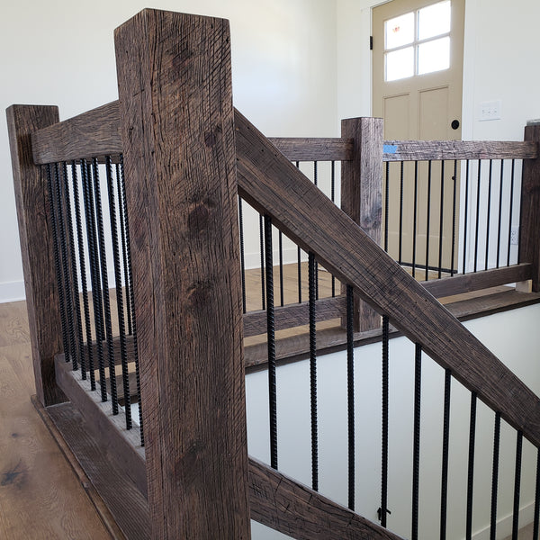 Custom rod railings made out of old wood surfacing.