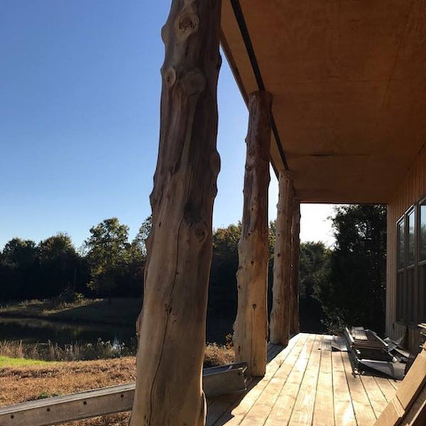 wrap a 4x4 post in a white cedar log on deck