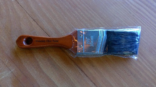 A bristle brush sitting on a table 