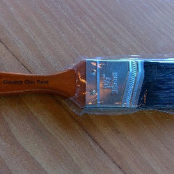 A bristle brush sitting on a table 