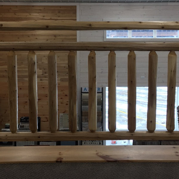 Cedar log railing with double top rail. 