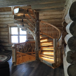 Interior of log home with spiral staircase