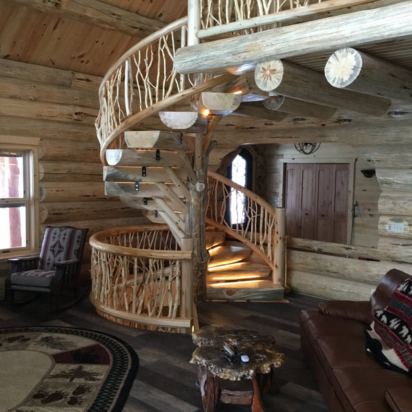 Spiral staircase going down to basement and up to loft