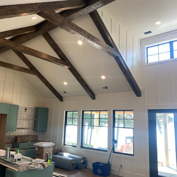 A kitchen remodel showing the old wood surfacing on the ceiling. 