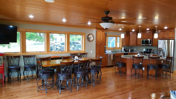 An open floor plan with Almond Johnson Pine across the ceiling with a bright wood