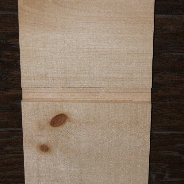 A close up example piece of example channel rustic siding. 
